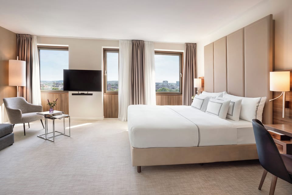 The Level Junior Suite with Executive Lounge Access | Desk, laptop workspace, blackout drapes, soundproofing