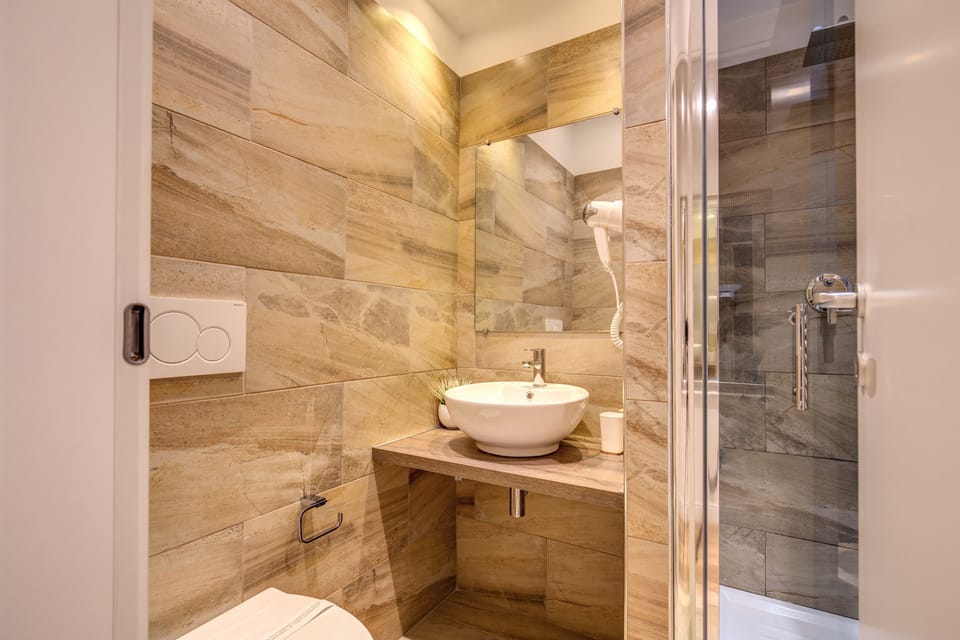 Shower, free toiletries, hair dryer, slippers