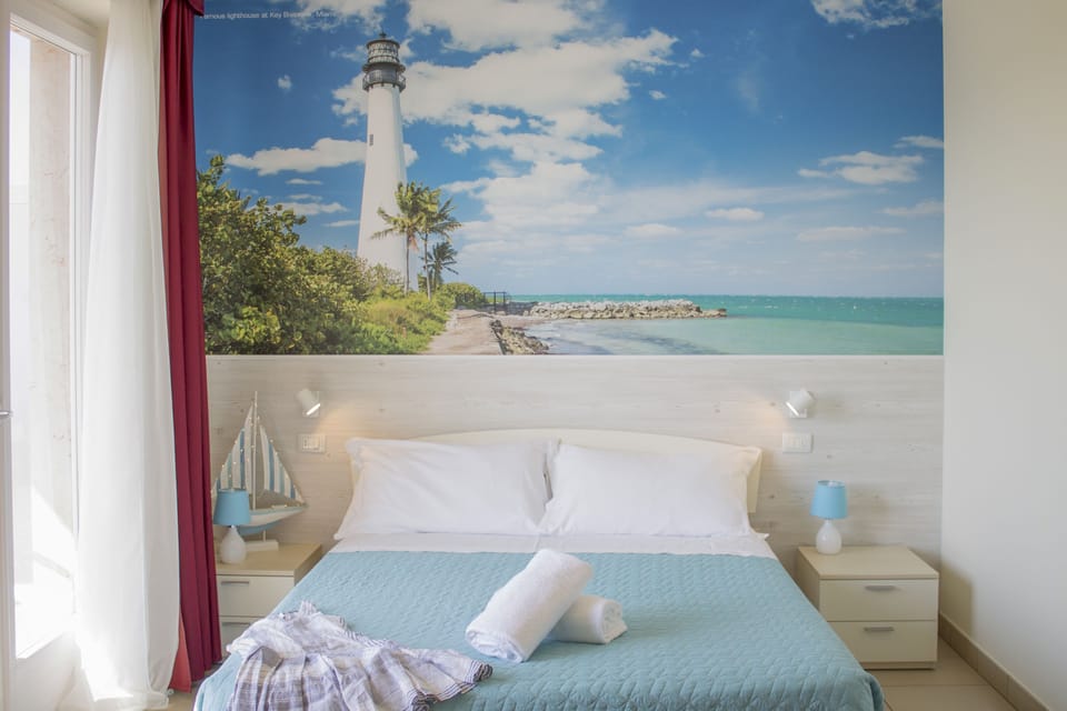 Double Room, Balcony, Partial Lake View | Minibar, in-room safe, individually decorated, desk