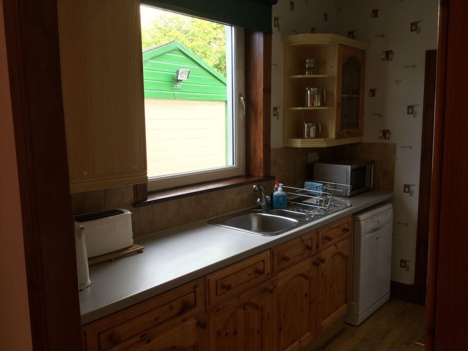 Three-Bedroom Apartment | Private kitchen | Full-size fridge, microwave, oven, stovetop
