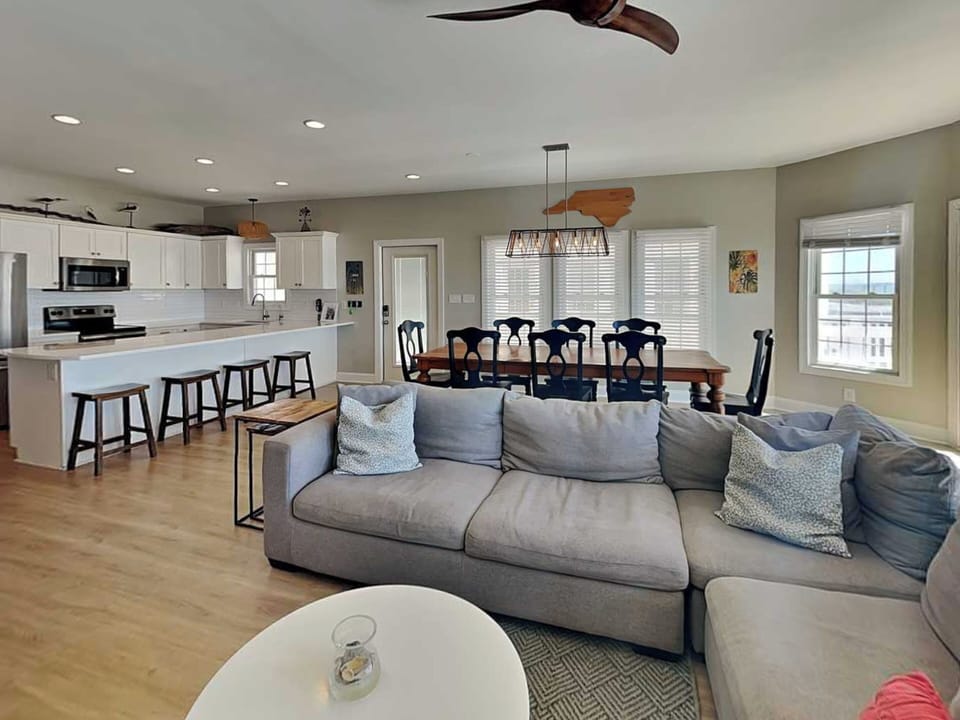 Living Room Flowing into the Dining Room and Kitchen