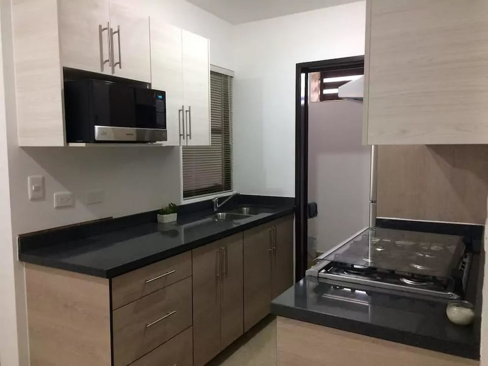 Family Townhome, 2 Bedrooms | Private kitchen | Full-size fridge, microwave