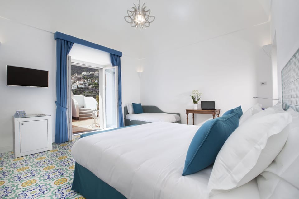 Triple Room, Patio | Minibar, desk, soundproofing, free WiFi