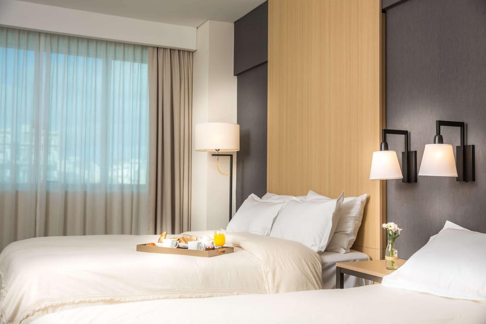 Premium bedding, down comforters, pillowtop beds, minibar