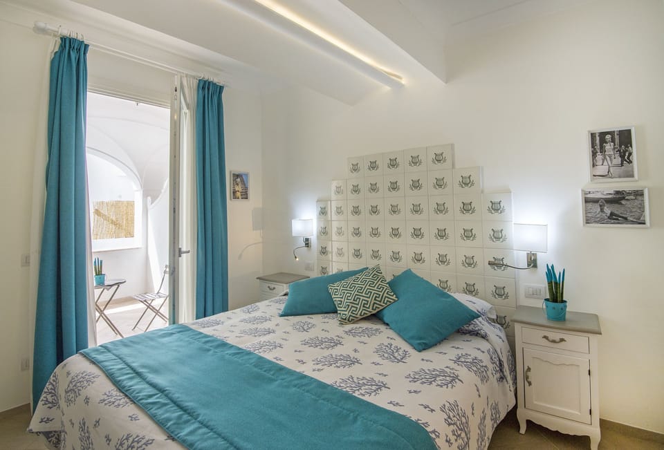 Family Suite, Sea View | Minibar, in-room safe, desk, soundproofing