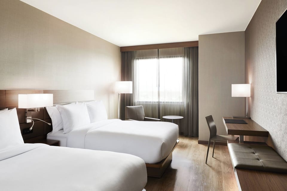 Premium bedding, down comforters, in-room safe, desk