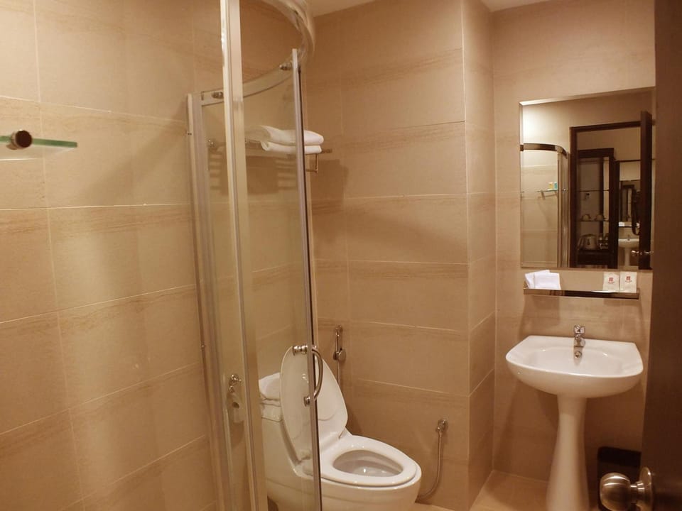 Shower, free toiletries, hair dryer, slippers