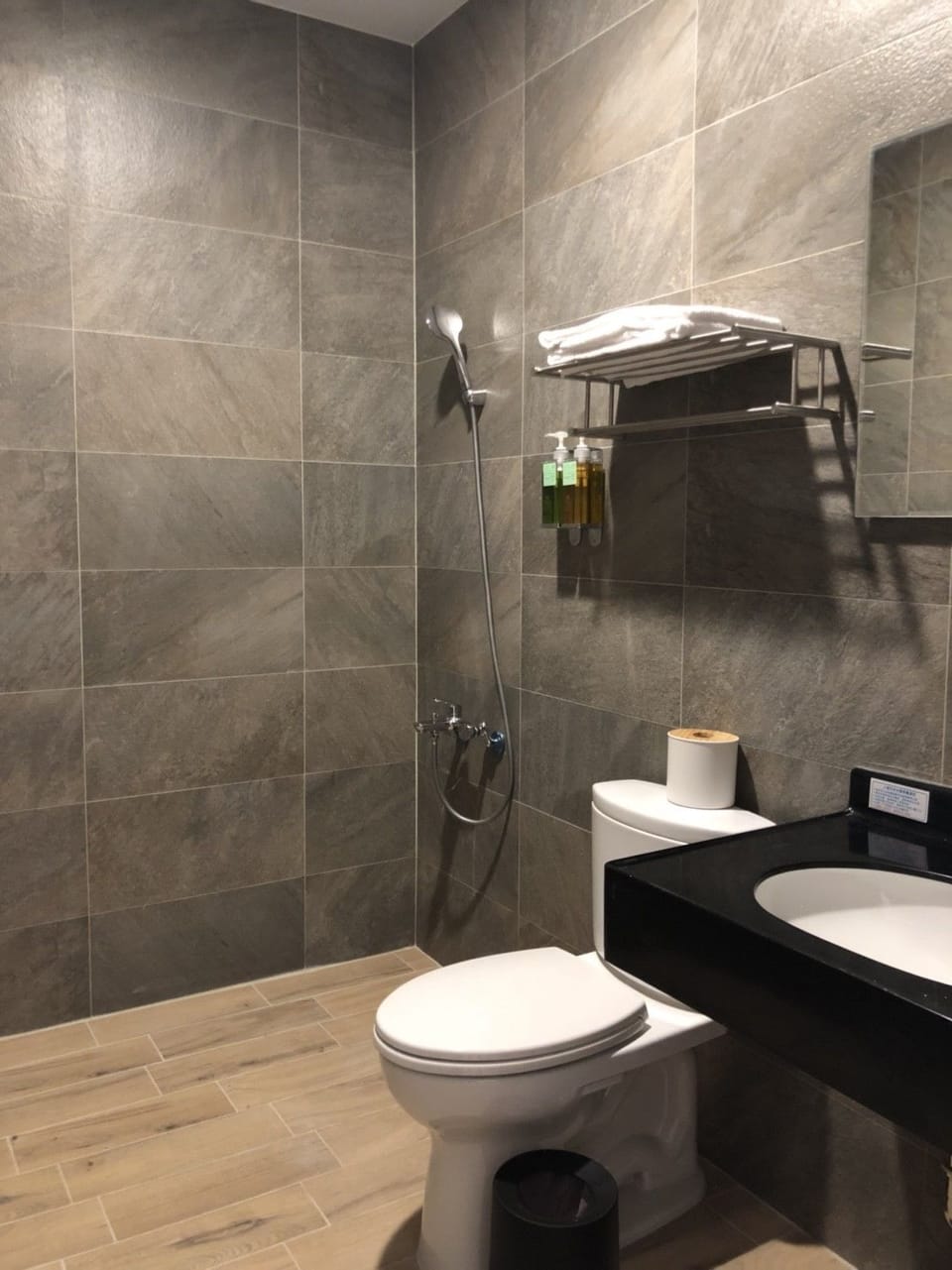 Shower, hair dryer, slippers, towels