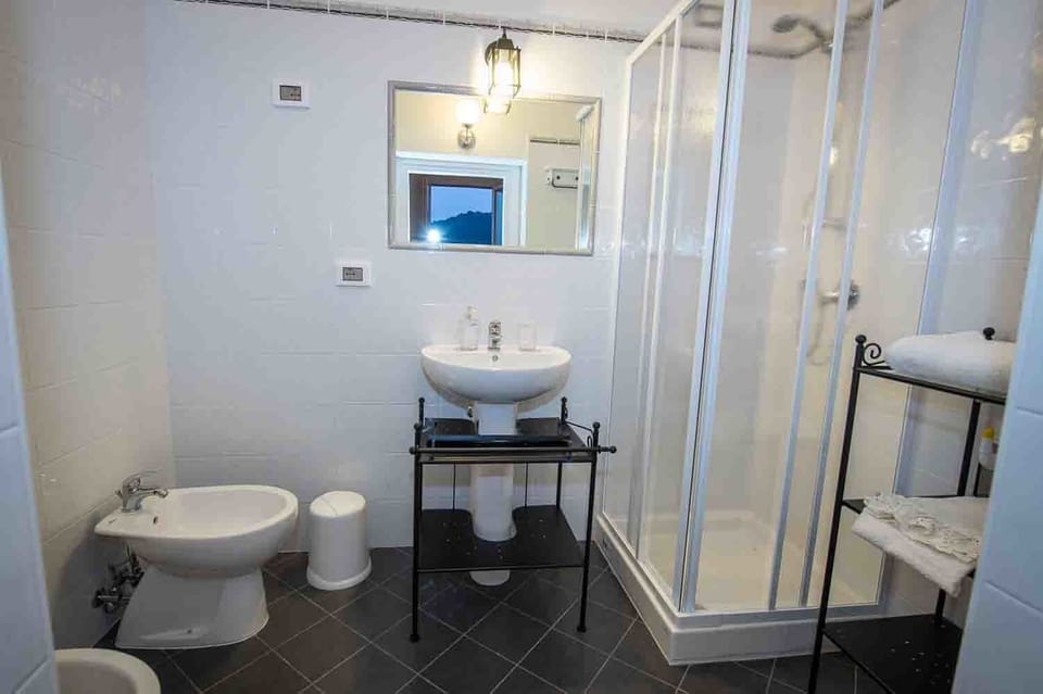 Deluxe Double Room, 1 Queen Bed, Private Bathroom, Oceanfront | Bathroom | Shower, free toiletries, hair dryer, bidet