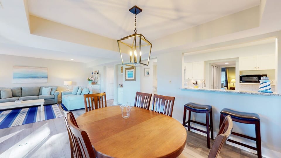 Dining Area Adjacent to Kitchen Bar Seating Two
