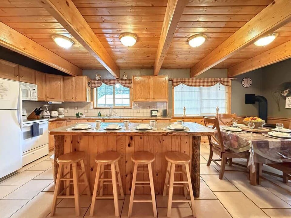 Full size kitchen with appliances, cookware, pots and pans, utensils, dishes, and basic cooking essentials.