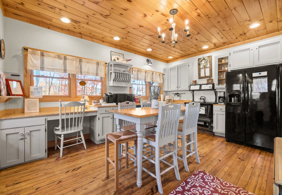 Full Kitchen and Dining Area with Bright Lighting