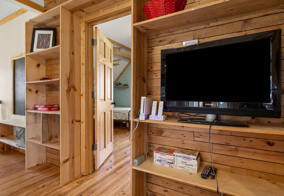 The Upstairs Has a Game Room with TV, Movies and a Foosball Table