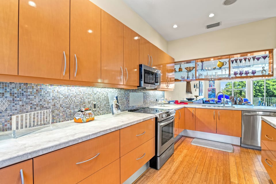 Expansive countertops provide ample workspace for cooking, prepping, or gathering with family and friends.