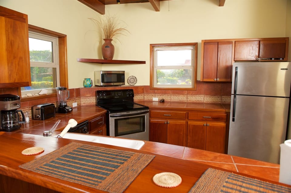 14 Another few steps puts you in the fully-outfitted kitchen with its own views.