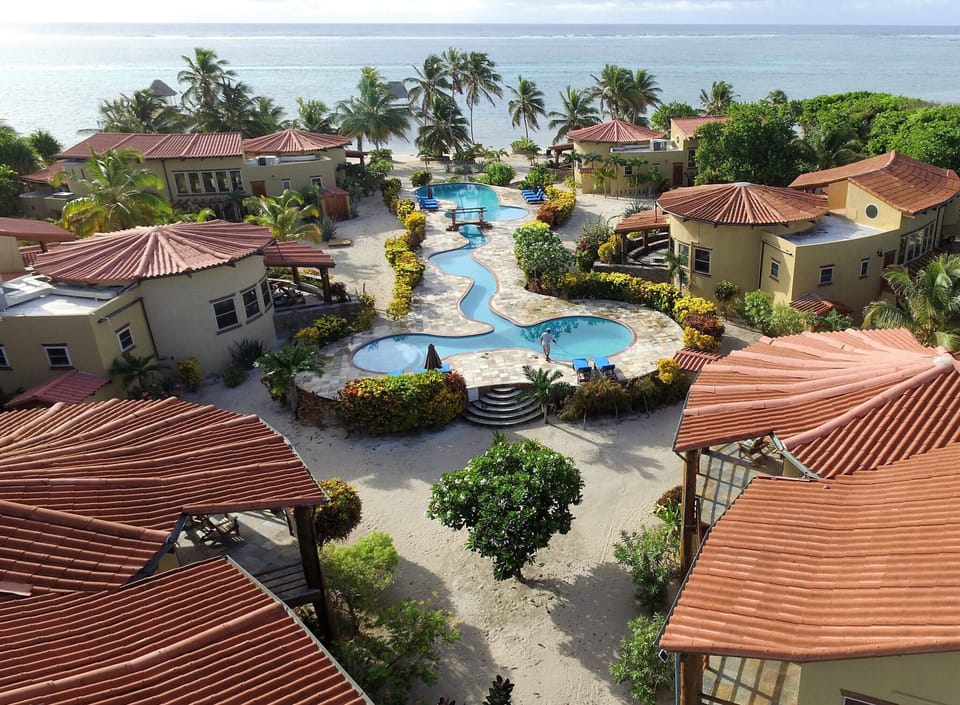 03 A back aerial shot showing us front left, the only rental right on the beach.