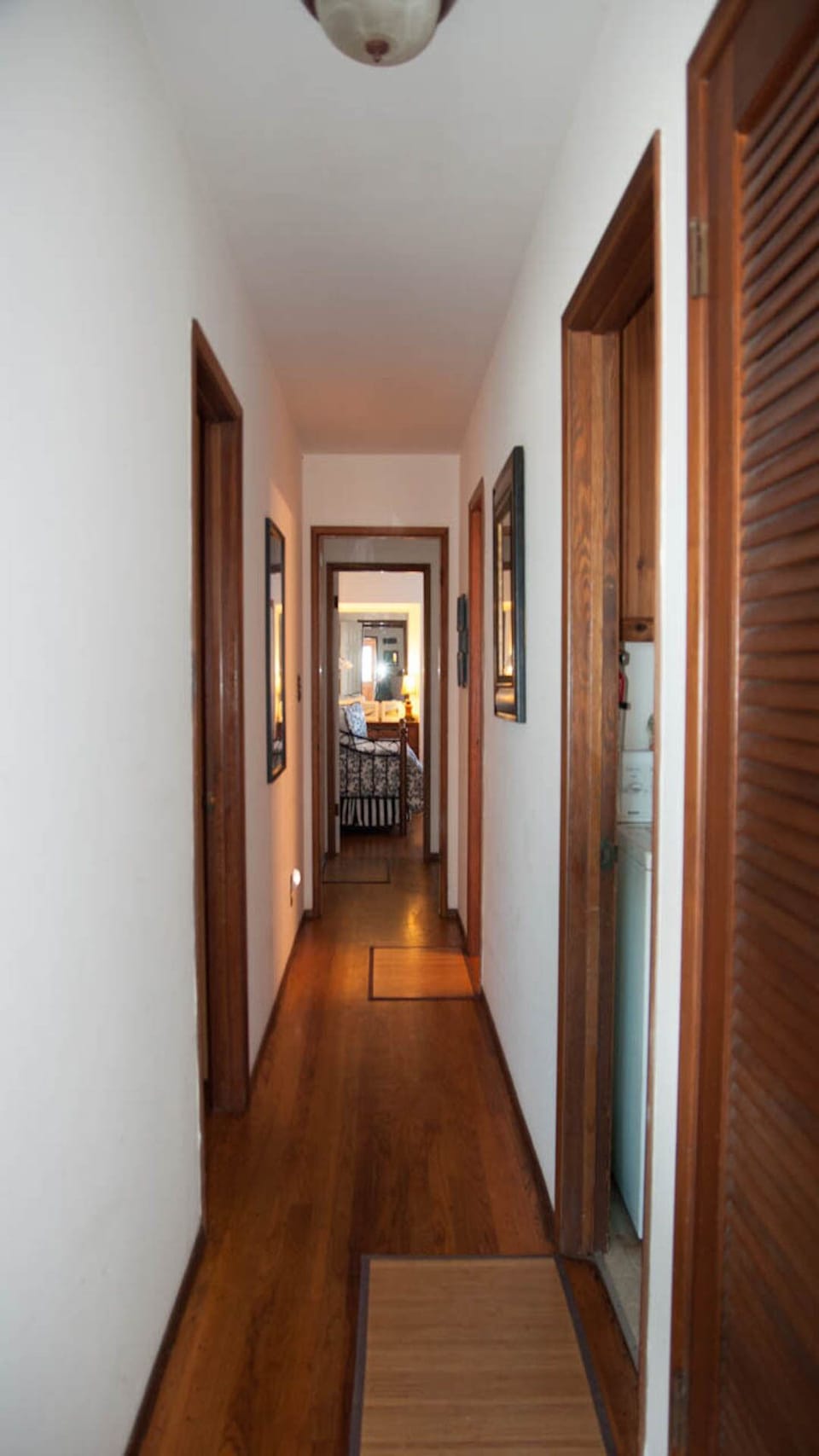 Hallway leading to bedrooms, bathrooms, laundry room