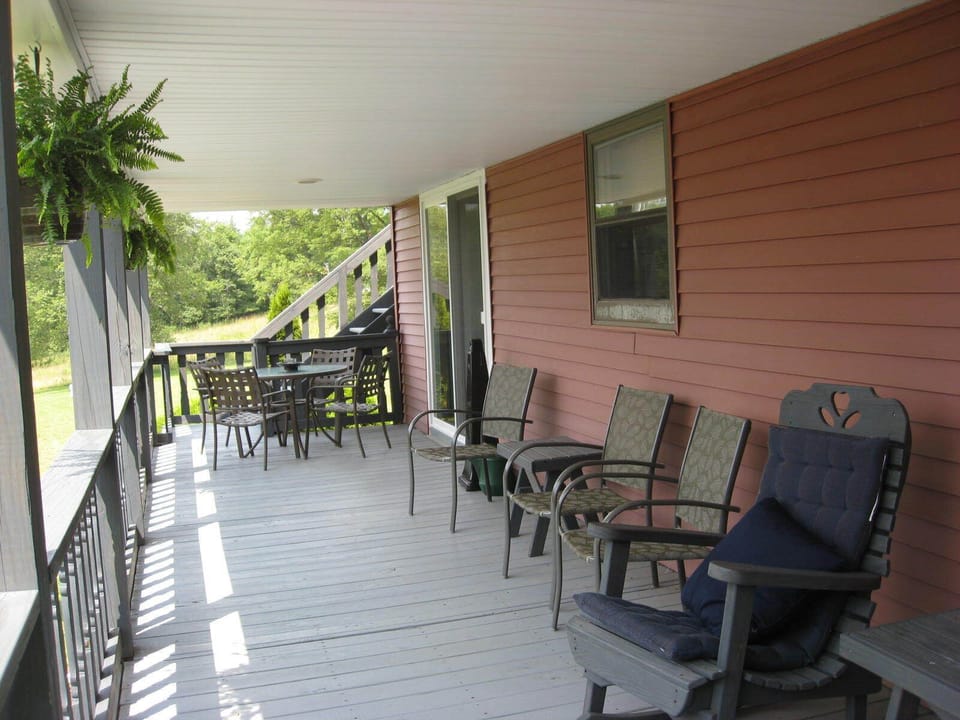 Nice long covered porch to watch the sun set from.