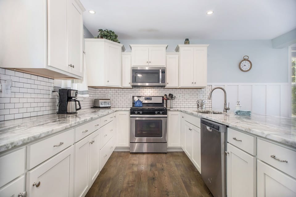 Custom tile backsplash and gas range and oven. 