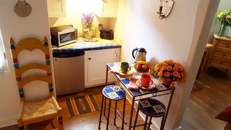 Kitchenette perfect for simple meals; Mexican tile table and bar stools.