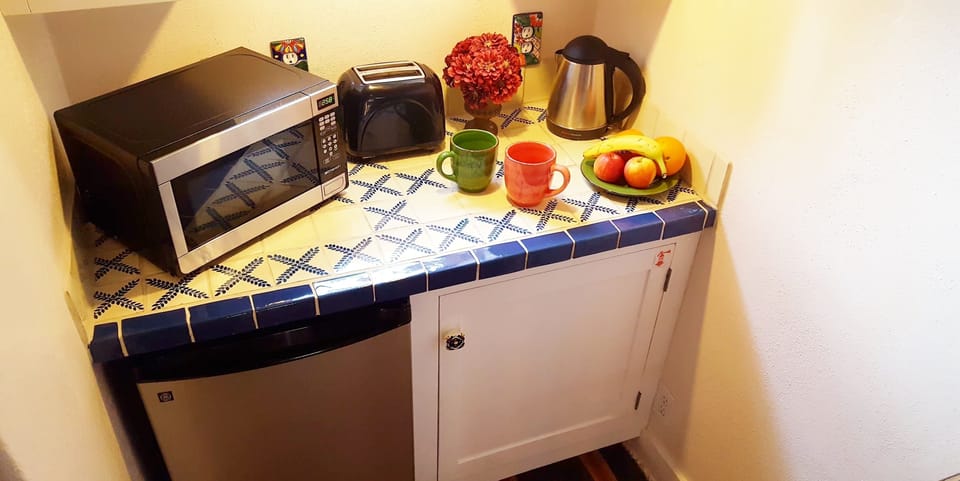Microwave, mini fridge, toaster, coffee and tea makers