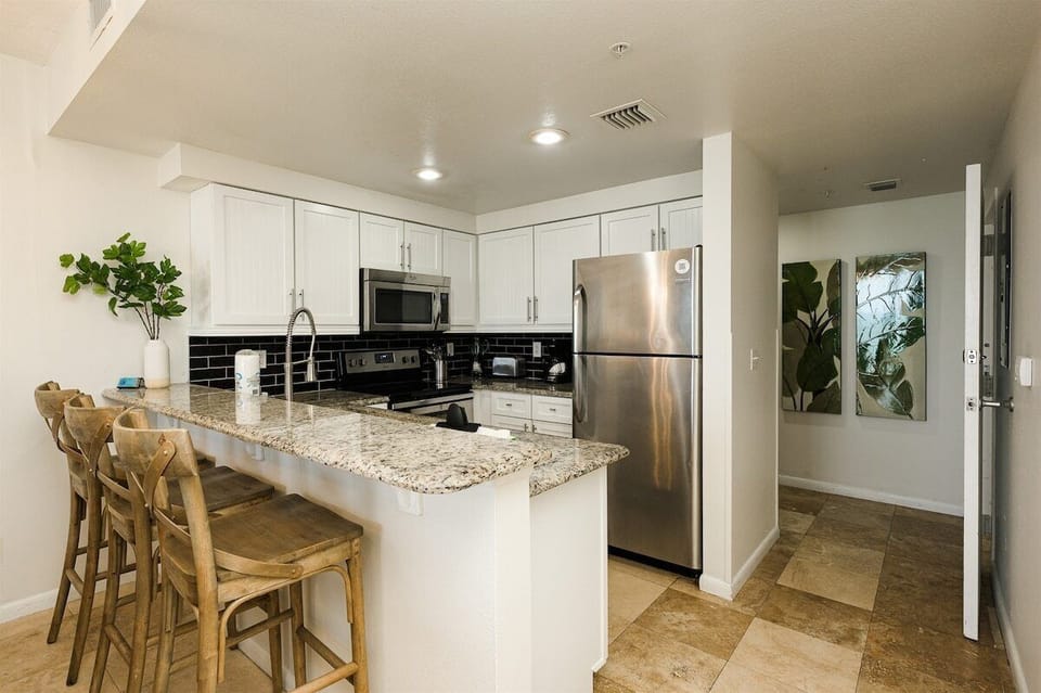 Kitchen with granite countertops and stainless steel appliances