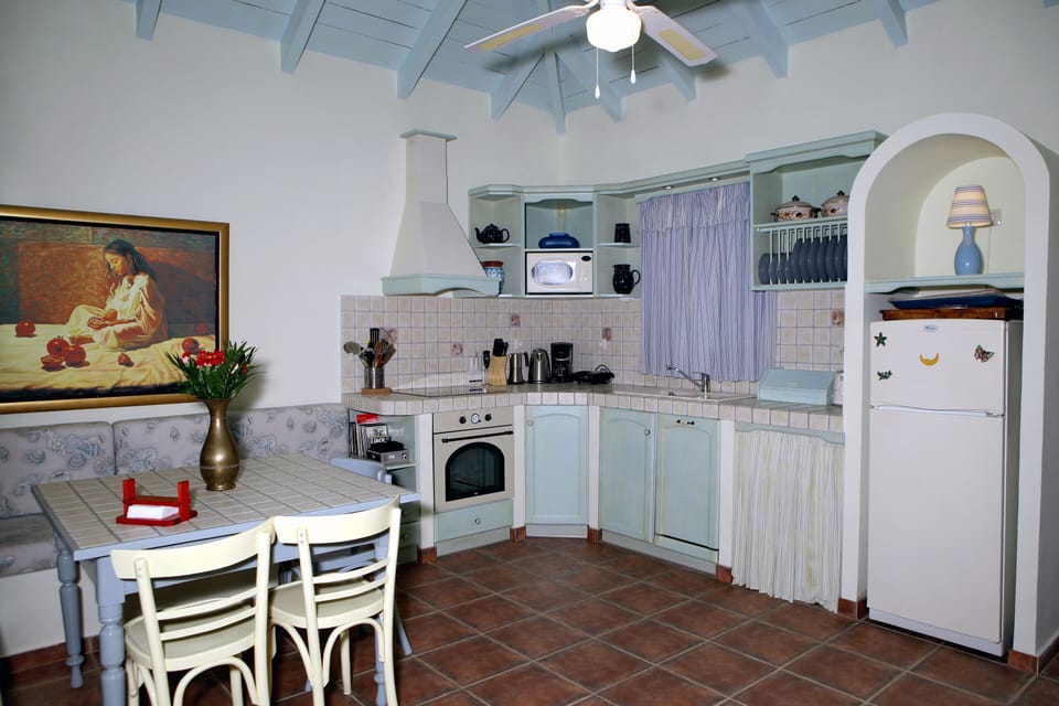 Kitchen area with all the appliances in local county style