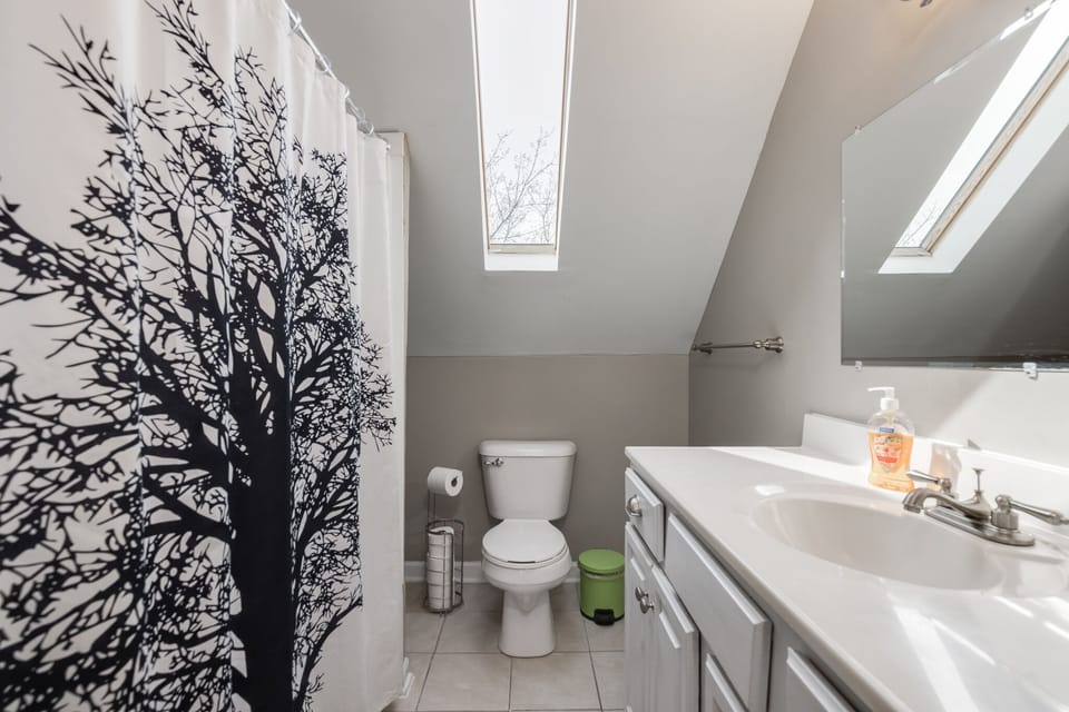 Full bathroom 2 on level 2 with tub, shower, and toilet