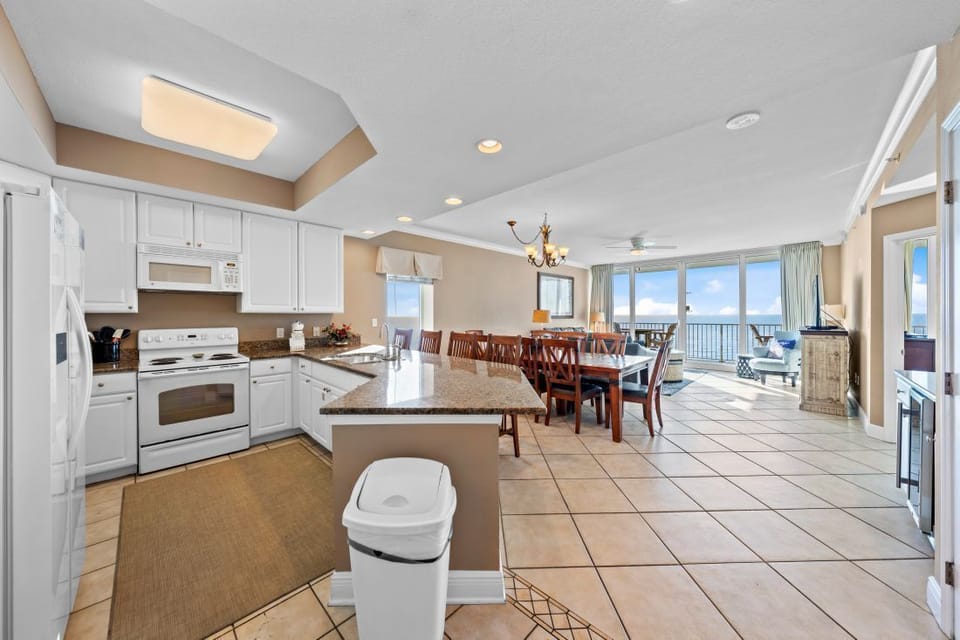 You'll love cooking and dining in this spacious beachfront kitchen with stunning ocean views through floor-to-ceiling windows.