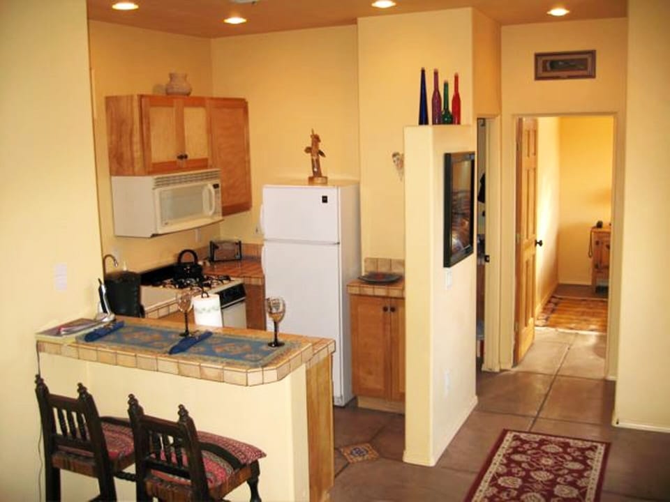 Hallway to Full Kitchen and Lovely Comfortable Bedroom