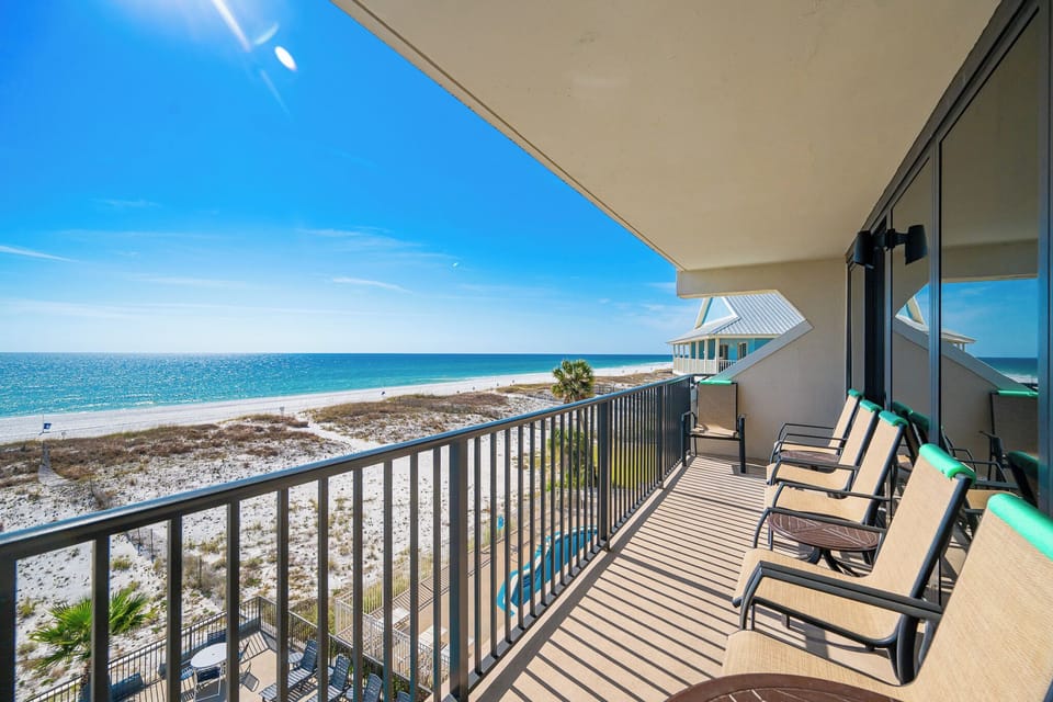 Unwind on your balcony while soaking in breathtaking beach views and the soothing sounds of the coast