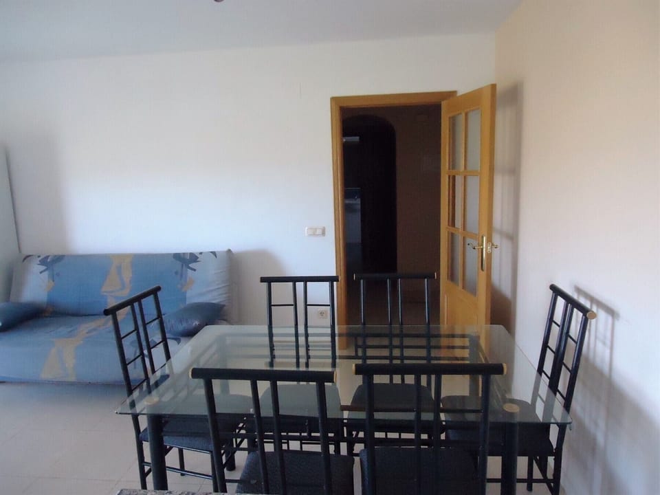 Detail of the table and the sofa bed