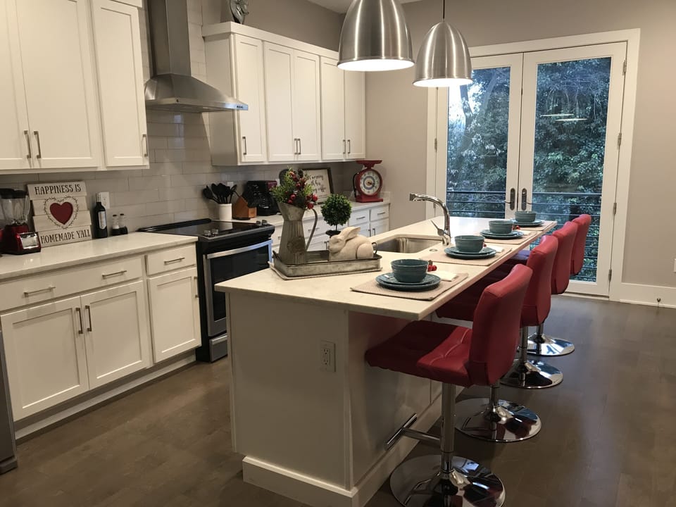 Spacious kitchen with large windows. Fully stocked. Super cozy with wet bar