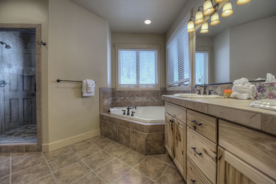 Master bathroom w/ walk-in shower, jacuzzi tub, double vanity, walk-in closet.