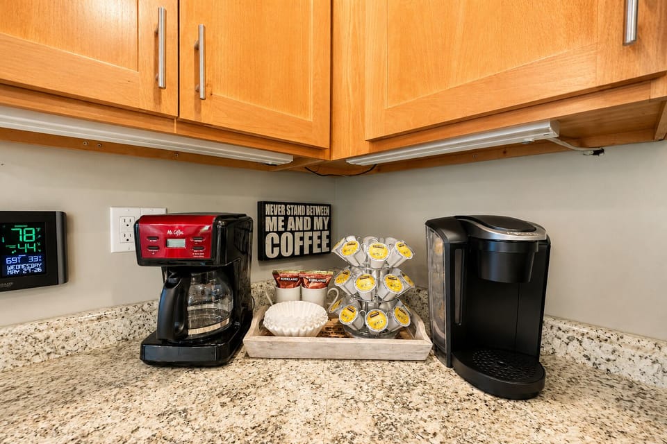 Complimentary coffee from the dual brewing stations—drip or single-serve—stocked with pods, filters, and mugs for your convenience.