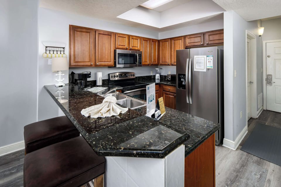 Fully stocked kitchen with breakfast bar