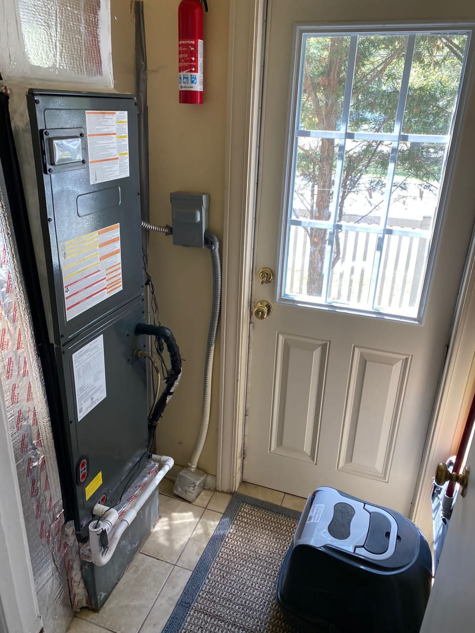 Utility room & 3rd exit to the side walkway and the private outdoor shower