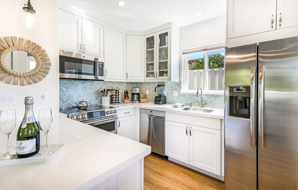 Gourmet kitchen with induction range, Vitamix, German knives, and more