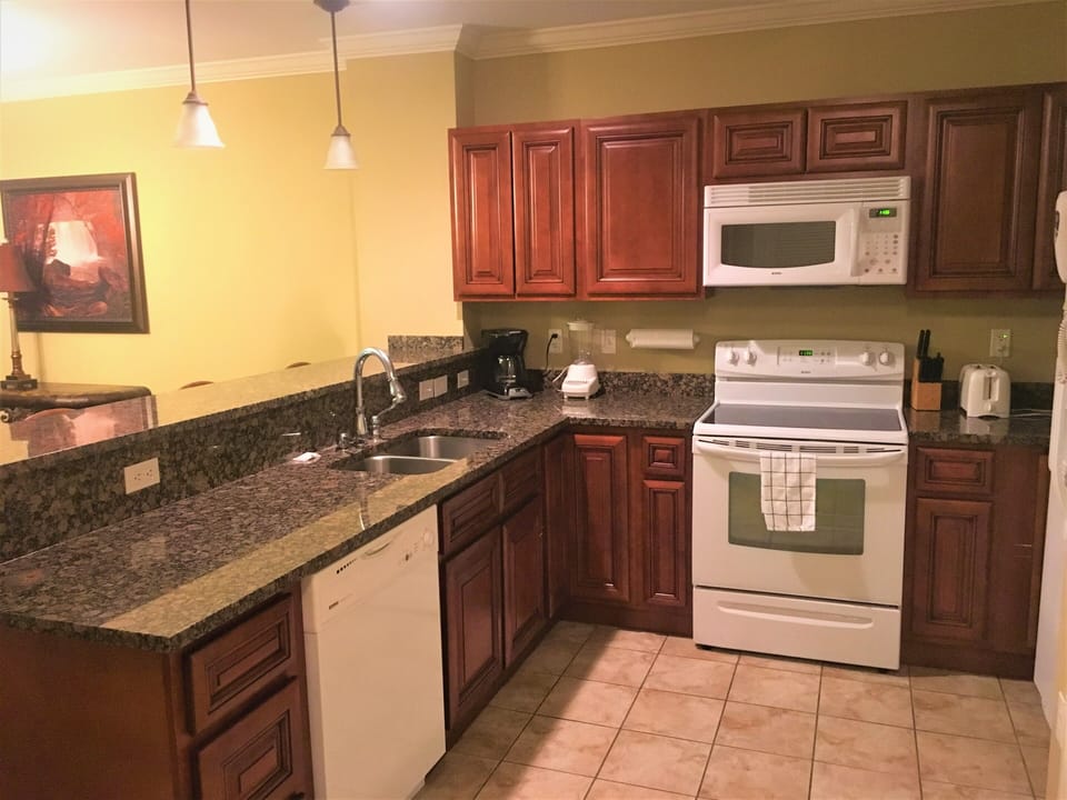 Full kitchen stocked with all necessary cooking supplies.