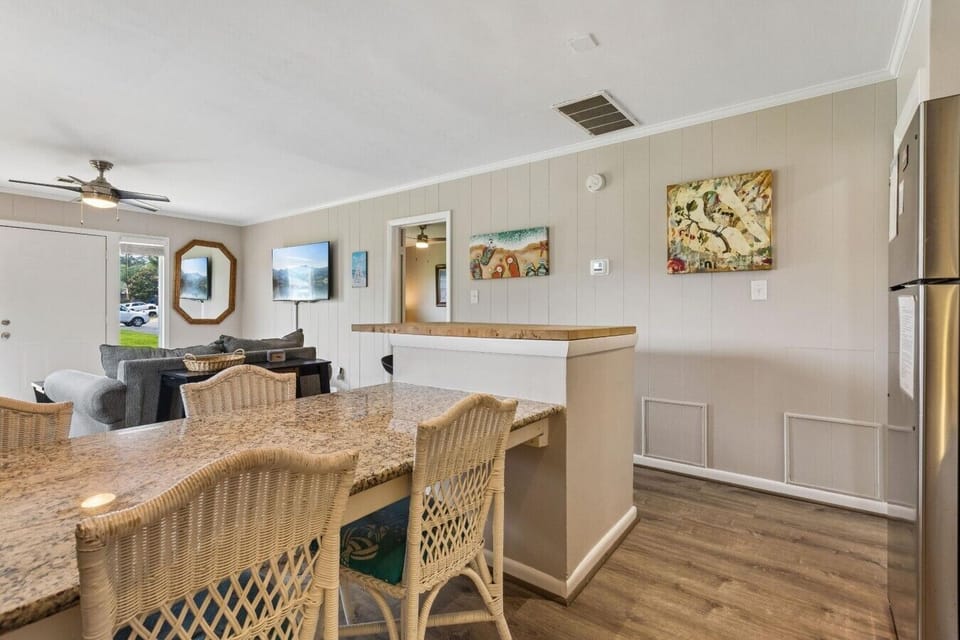 Enjoy a cohesive dining and living room so you don`t miss any of the action.