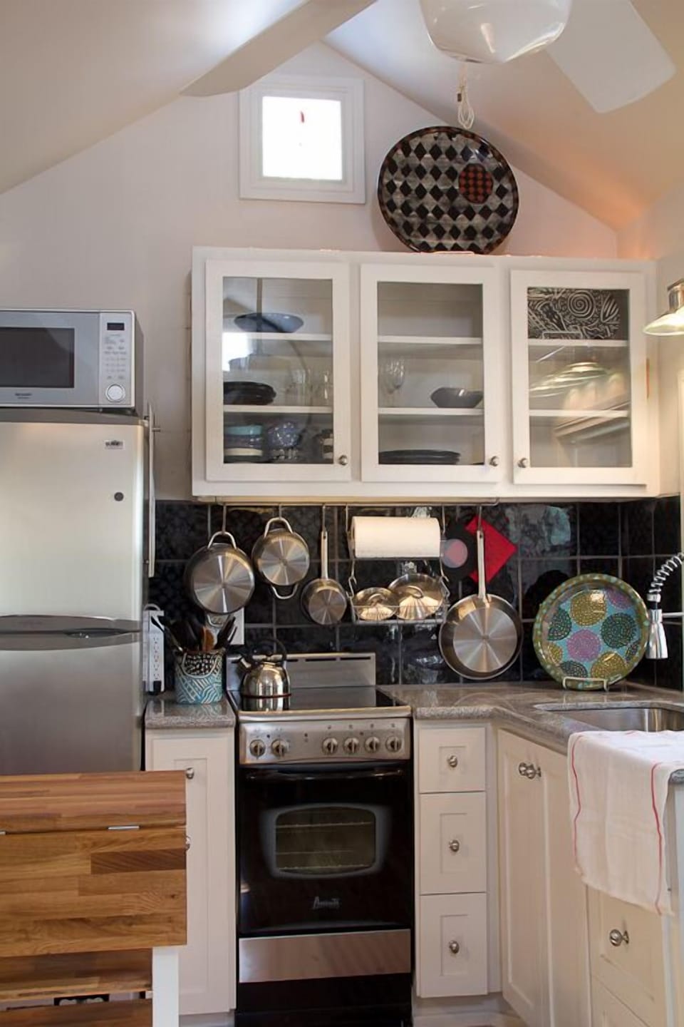 Well lighted kitchen. Custom cabinets,granite countertop, chopping block.