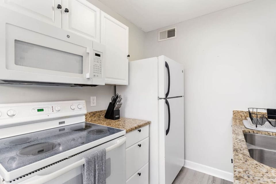 Our fully equipped kitchen has a refrigerator, oven, stovetop, and microwave.