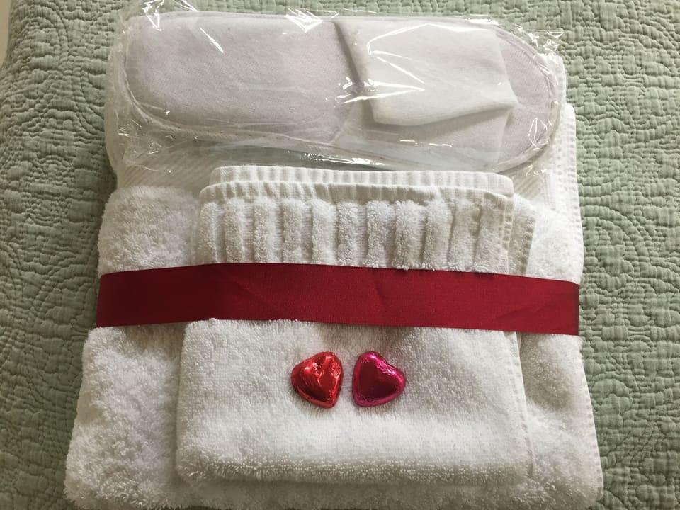 Freshly laundered towels, robes and spa slippers are ready to welcome all guests
