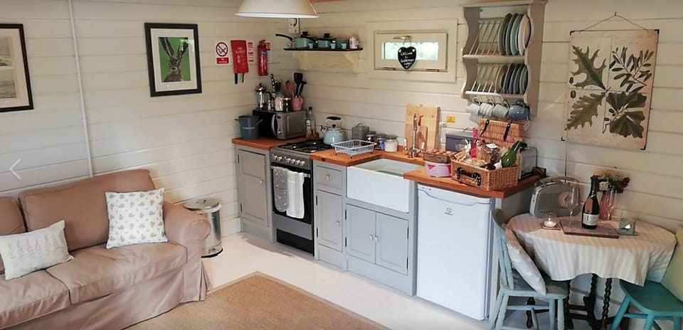 Lounge and Kitchen Area at Cuttermoon Lodge. The lounge has a double sofa bed 
