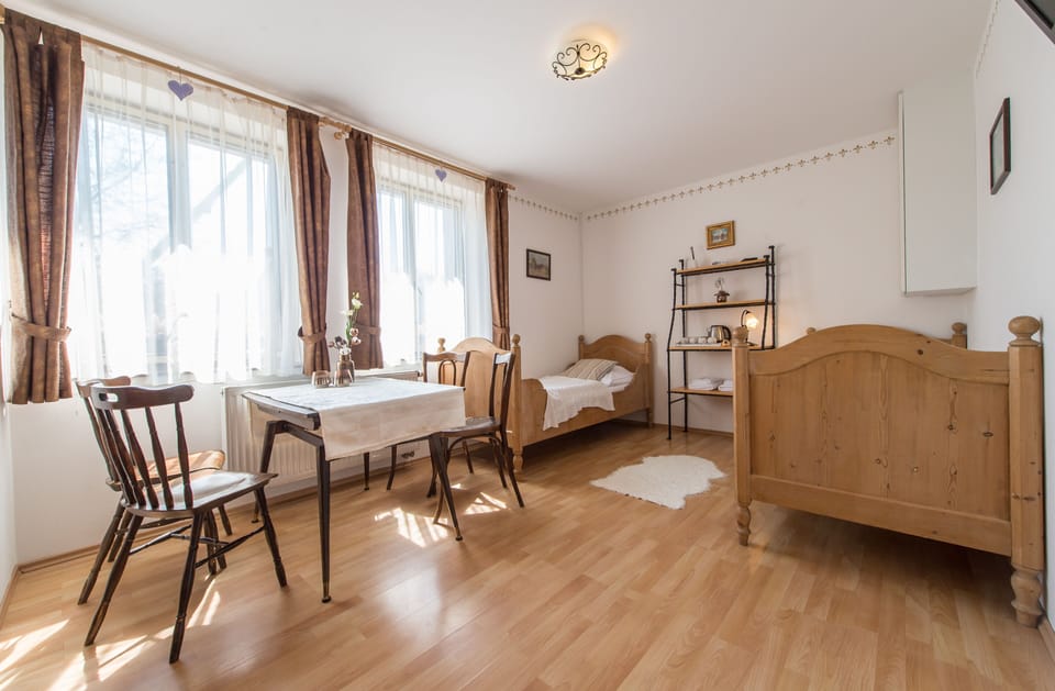 Family Quadruple Room, 2 Bedrooms | Minibar, blackout drapes, WiFi (free), bed sheets