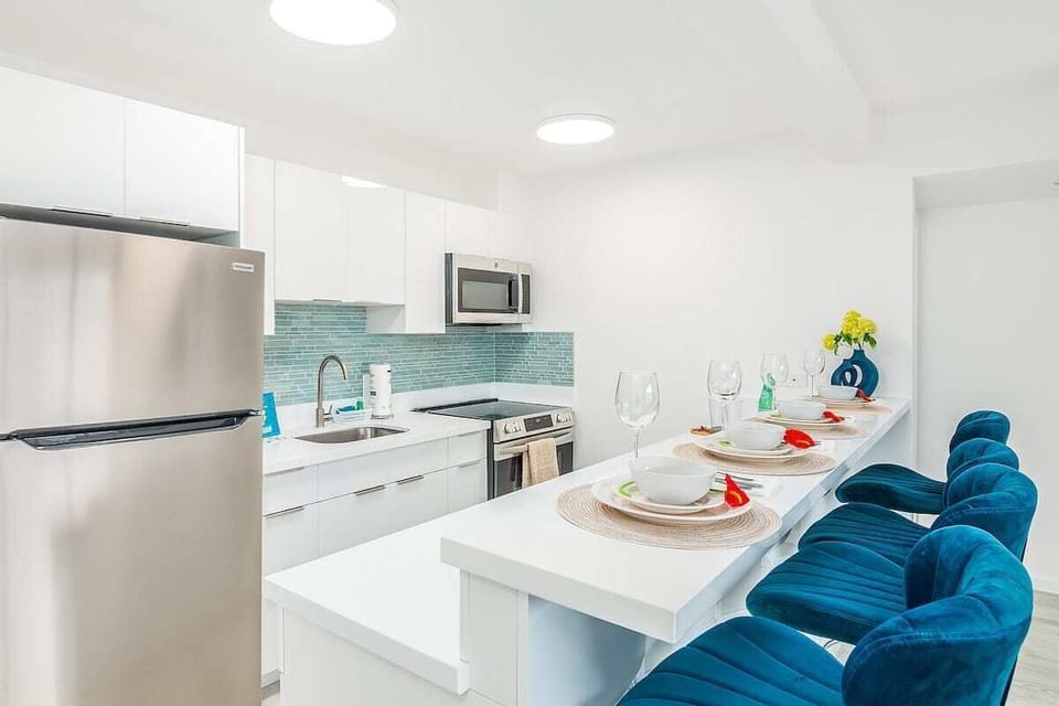 Whip up delicious meals in your fully equipped, modern kitchen, featuring a stylish breakfast bar and all the essentials for a comfortable stay.