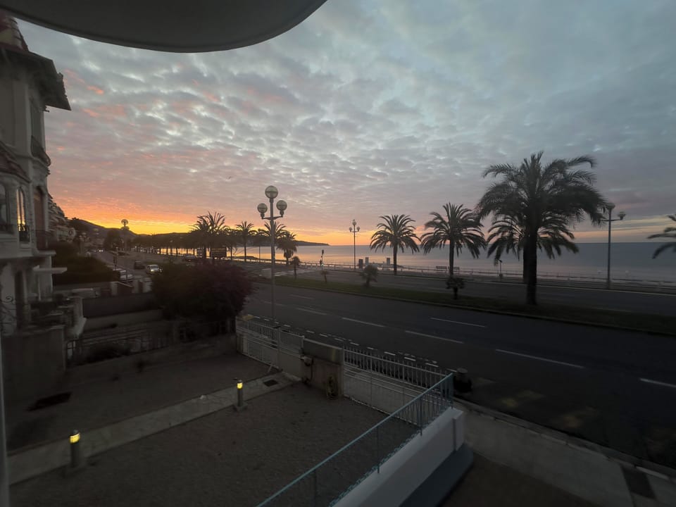 Sunrise across the Baie des Anges viewed from apartment balcony