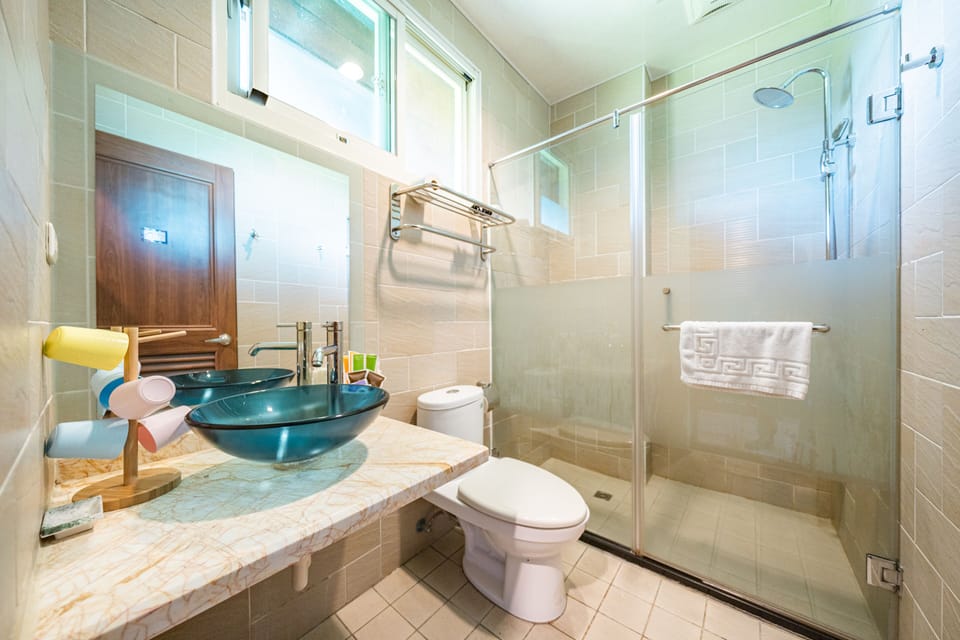 Shower, free toiletries, hair dryer, slippers