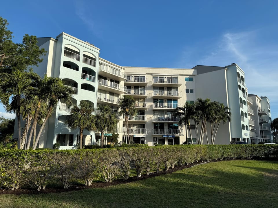 Our condo is on the 5th floor just above the palm trees.