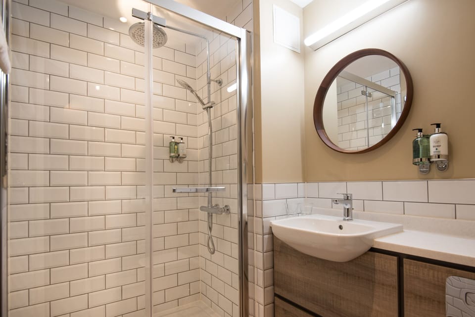 Shower, eco-friendly toiletries, hair dryer, towels